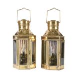 A pair of brass and glazed wall lights in the manner of maritime lanterns