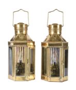 A pair of brass and glazed wall lights in the manner of maritime lanterns