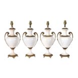 A set of four Continental gilt metal mounted glazed ceramic table lamps