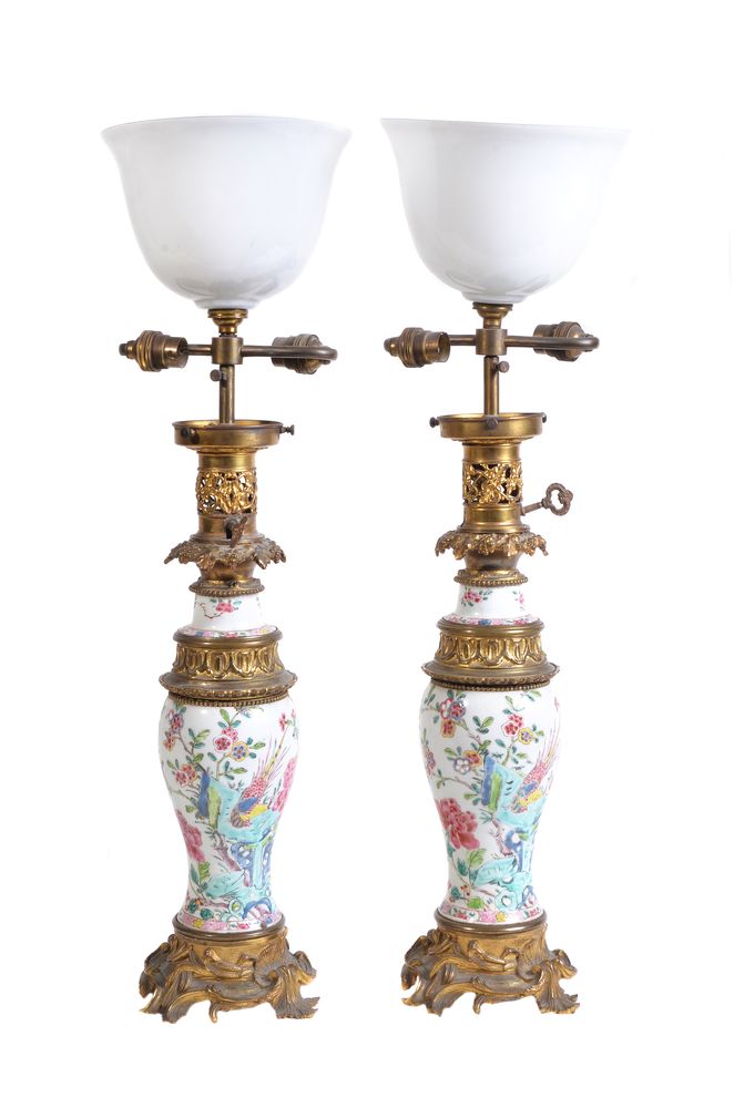 A pair of Chinese 'Famille Rose' gilt-metal mounted vases