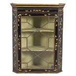 A George III black and gilt japanned corner wall cupboard