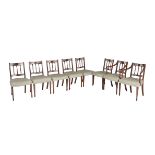 A set of eight George III mahogany dining chairs