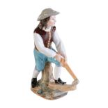 A Moscow porcelain (Popov Factory) model of an axeman