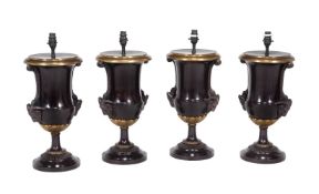 Two pairs of bronze and brass mounted table lamps in neoclassical style
