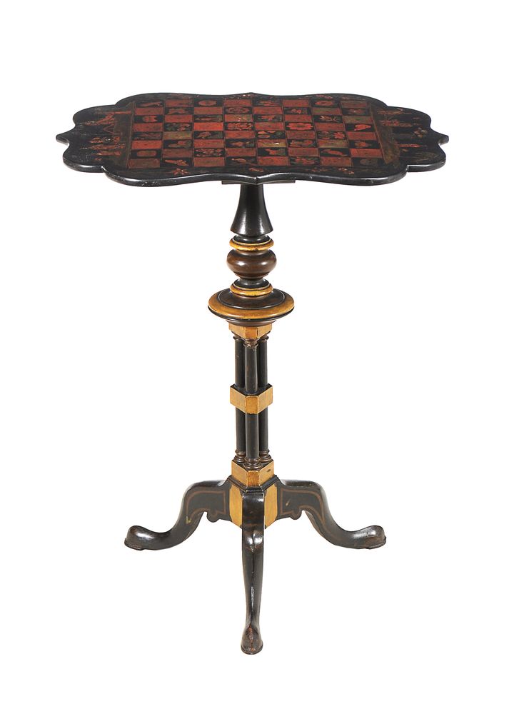 An ebonized, parcel gilt, and Japanned games table