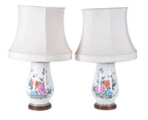 A pair of floral painted lamps
