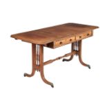 ϒ A mahogany and ebony inlaid sofa table in Regency style