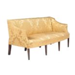 A mahogany and yellow silk upholstered settee