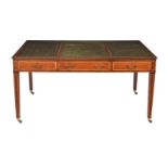 A mahogany and satinwood banded library table, in George III style
