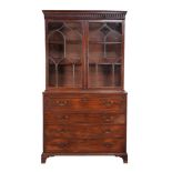 A George III mahogany and inlaid secretaire bookcase