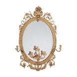 A Victorian giltwood and composition oval wall mirror