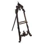 A Continental carved and stained walnut A-frame gallery easel