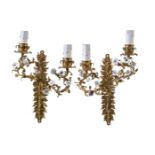 A pair of gilt metal and porcelain mounted twin light wall appliques in Louis XV style