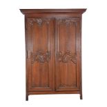 A Louis XV carved walnut two door press cupboard