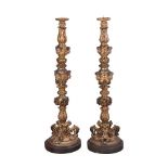 A pair of Italian carved giltwood torchere stands