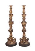 A pair of Italian carved giltwood torchere stands
