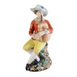 A Moscow porcelain (Popov Factory) model of a man playing bagpipes