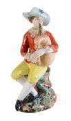 A Moscow porcelain (Popov Factory) model of a man playing bagpipes