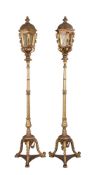 A pair of Italian carved giltwood and glazed standard lanterns in 18th century Venetian taste