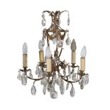 A gilt metal and cut glass hung five branch chandelier