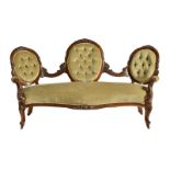 A mid-Victorian mahogany and upholstered settee