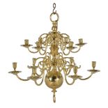 A Dutch or English cast and turned brass twelve light chandelier in 18th century taste