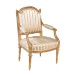 A carved giltwood and composition armchair in Louis XVI style