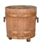 A teak and copper bound bucket or planter