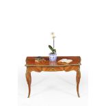 ϒ A French tulipwood and gilt metal mounted bureau plat