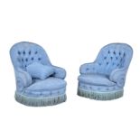 A pair of Victorian walnut and blue watered silk upholstered nursing chairs