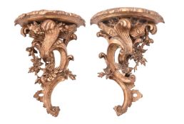 A pair of carved and giltwood wall brackets in late Louis XV taste