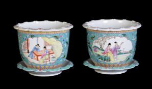 A pair of Chinese turquoise-ground 'Famille Rose' jardinières and stands