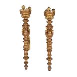 A pair of gilt bronze three light wall torcheres in Baroque taste