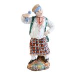 A Russian porcelain figure of a peasant woman