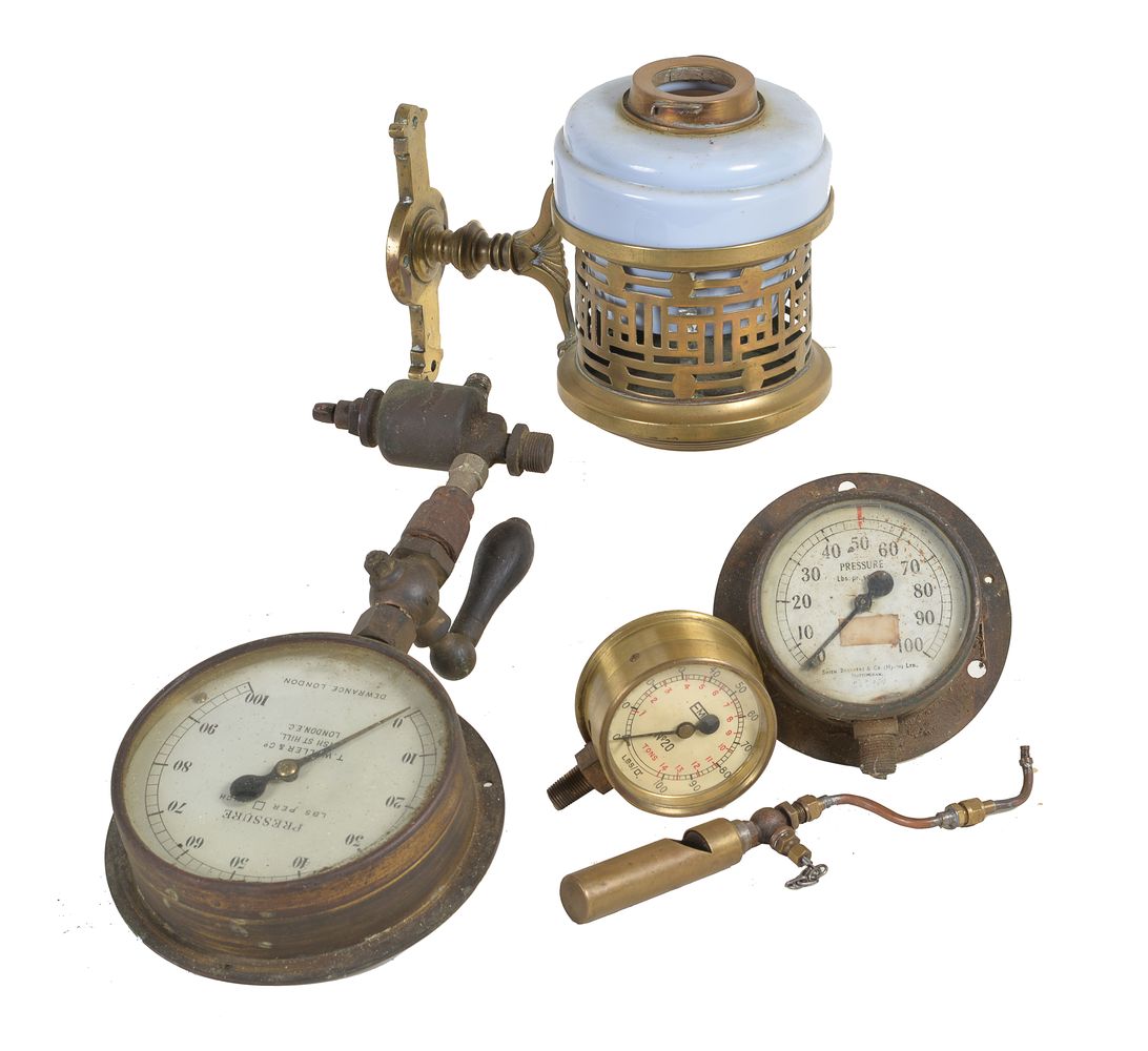 A collection of three full size steam pressure gauges