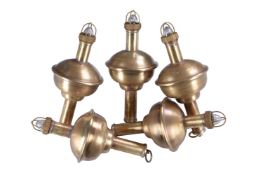 A collection of five polished brass marine floats