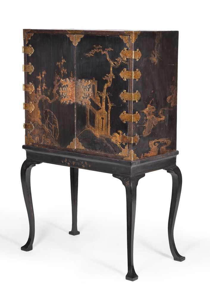 A black lacquer and gilt chinoiserie decorated cabinet on stand