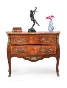 ϒ A French rosewood and tulipwood serpentine commode