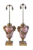 A pair of Continental gilt metal mounted jasper table lamps in Louis XVI style