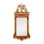 A George II mahogany and parcel gilt wall mirror