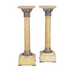 A pair of French onyx and gilt metal mounted pedestals