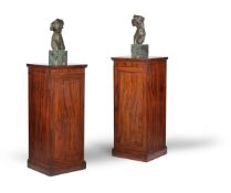 A pair of George III mahogany pedestals