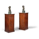 A pair of George III mahogany pedestals