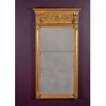 A carved giltwood and composition wall mirror