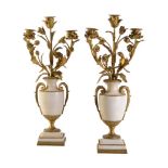 A pair of Continental white marble and gilt bronze mounted three light candelabra