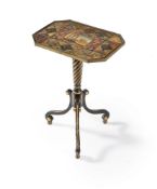 A Regency ebonised and parcel gilt tripod table