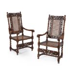 A pair of Charles II caved walnut armchairs