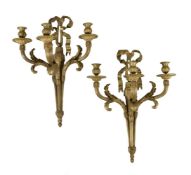 A pair of substantial gilt bronze three light wall appliques in Louis XVI taste