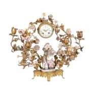 A French gilt-metal and porcelain flower-mounted clock ensemble with Meissen Commedia dell'Arte grou