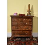 A Queen Anne walnut and burr walnut bachelor's chest